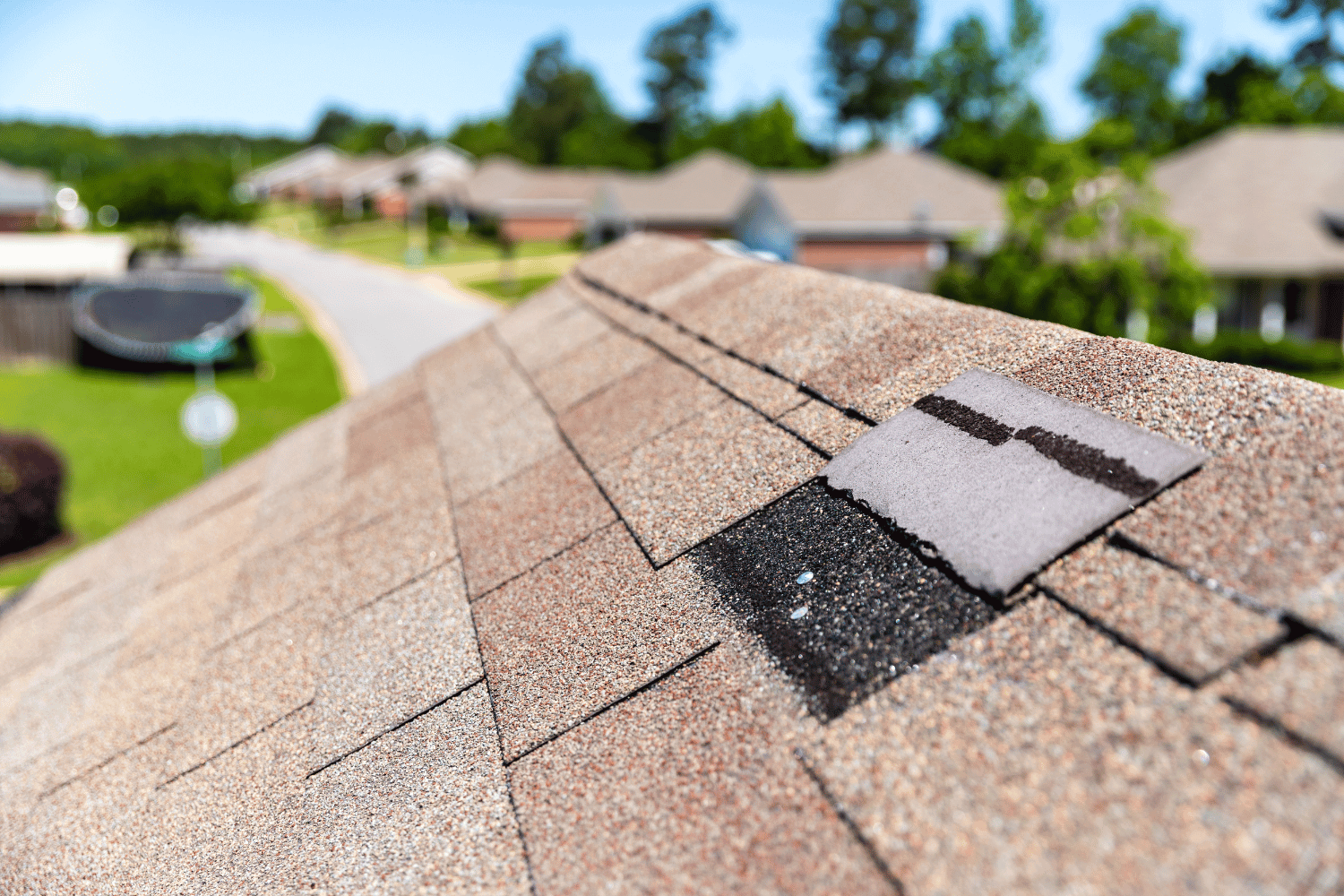 An illustration of a person filing an insurance claim for hail damage to their roof. 