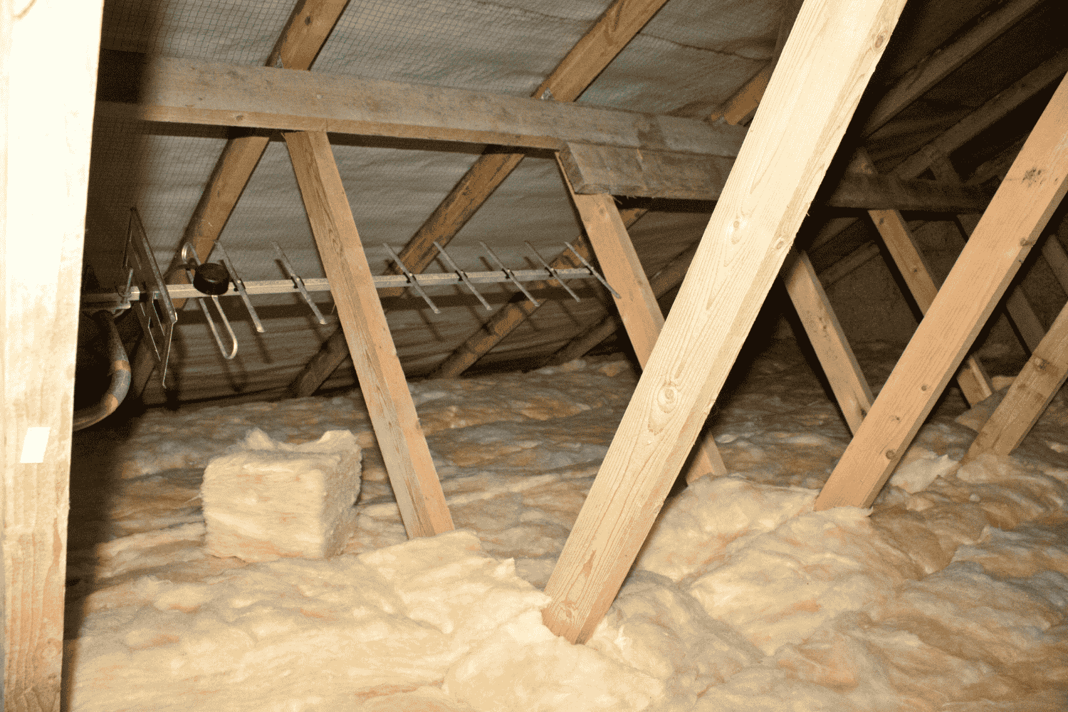 Different types of blown insulation materials in an attic.