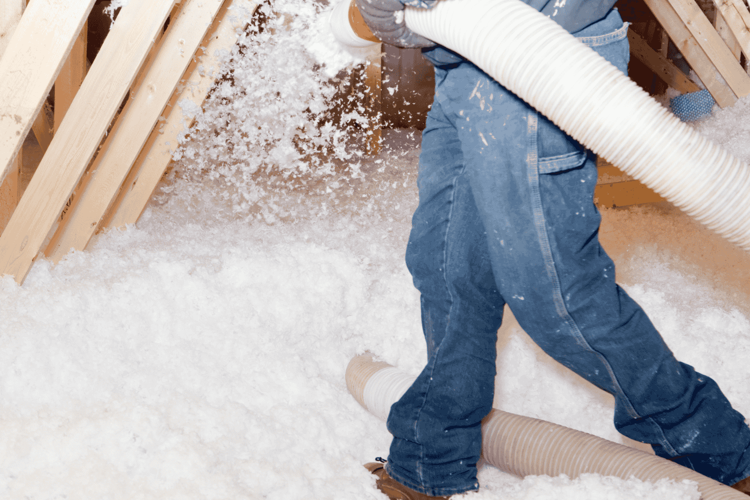 Safety gear and precautions for navigating an attic with blown insulation.